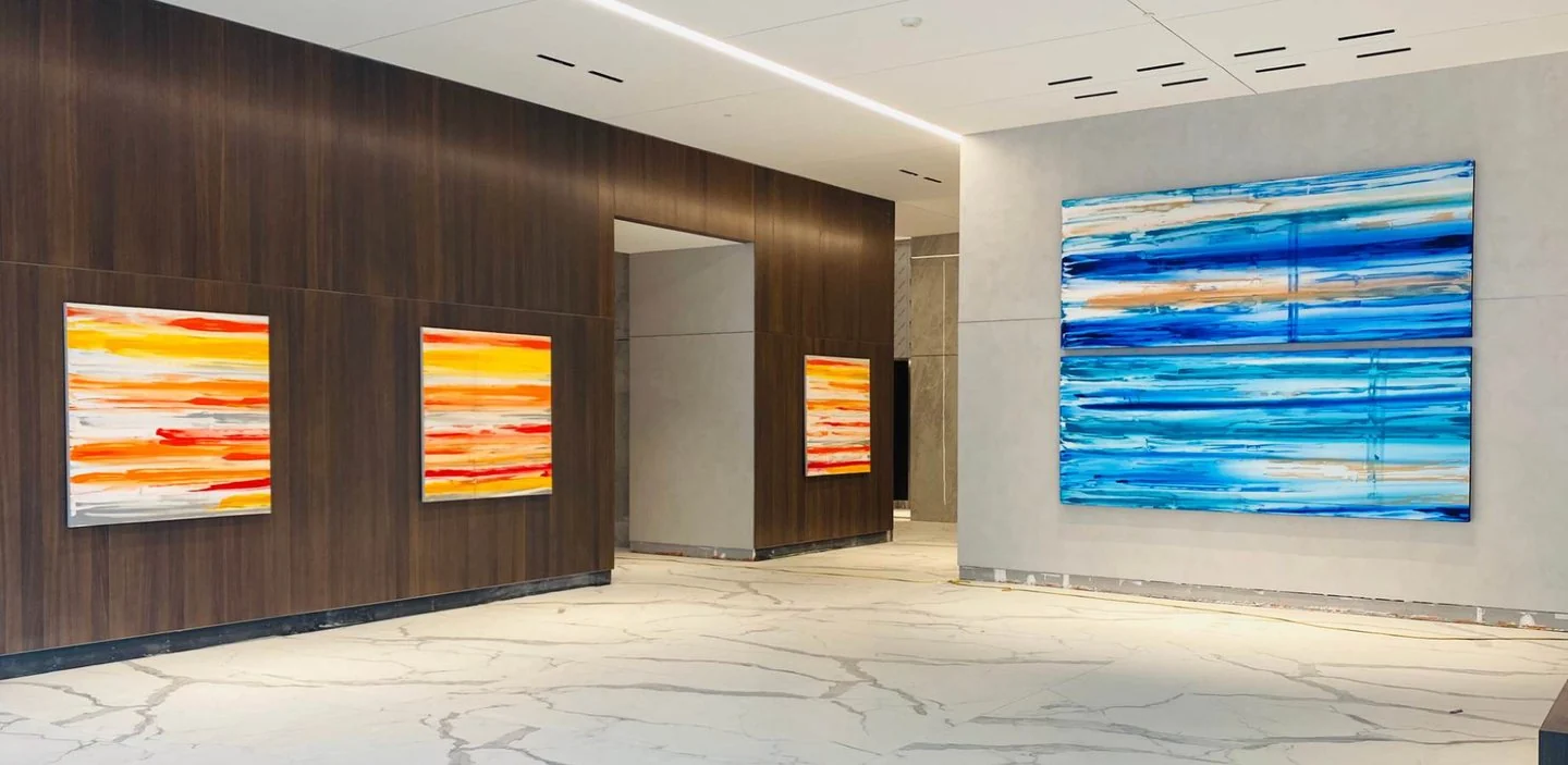 Four custom Raw Collection paintings by Erik Skoldberg installed in the Gulch Union lobby in Nashville