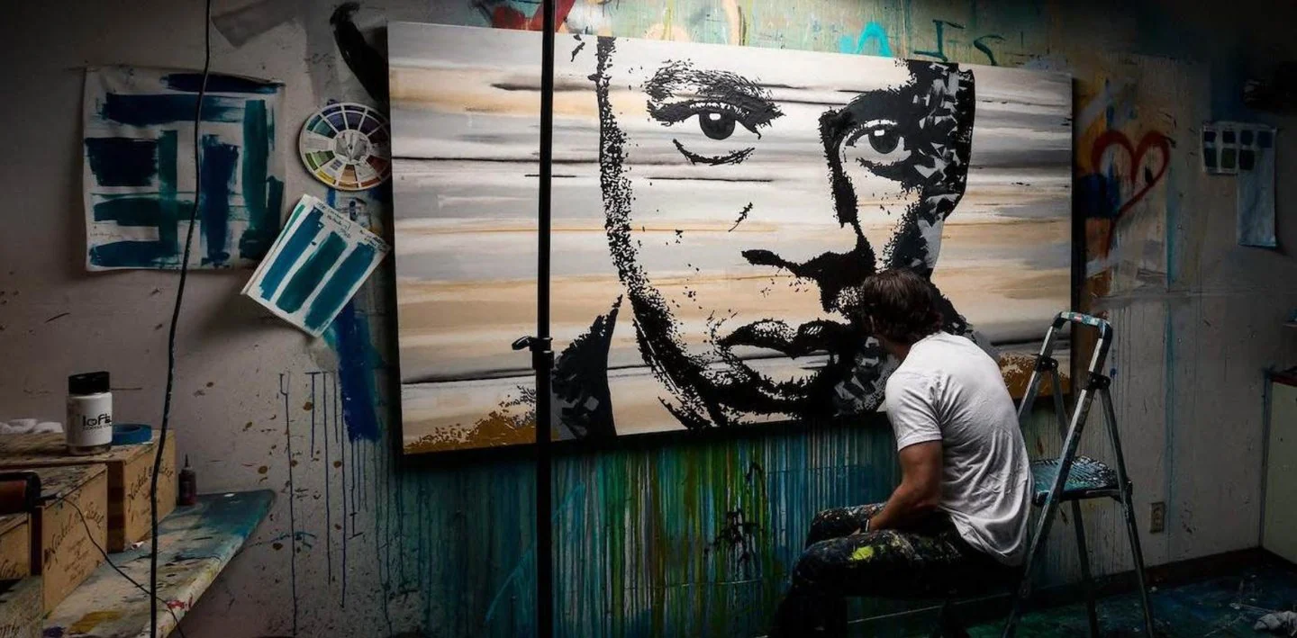 Erik Skoldberg at work on the large black-and-white portrait now on exhibition at Roc Nation headquarters in New York